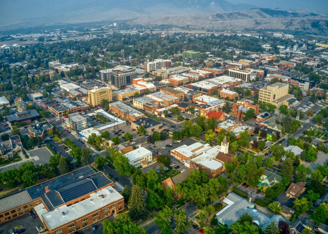 <p>- Population: 51,574<br> - National rank: Not Ranked</p>  <p>Bozeman is home to Montana State University, which has more than 16,000 enrolled students. The city is surrounded by mountain ranges and offers attractions like the Museum of the Rockies. Bozeman Yellowstone International Airport is the largest airport in Montana.</p>