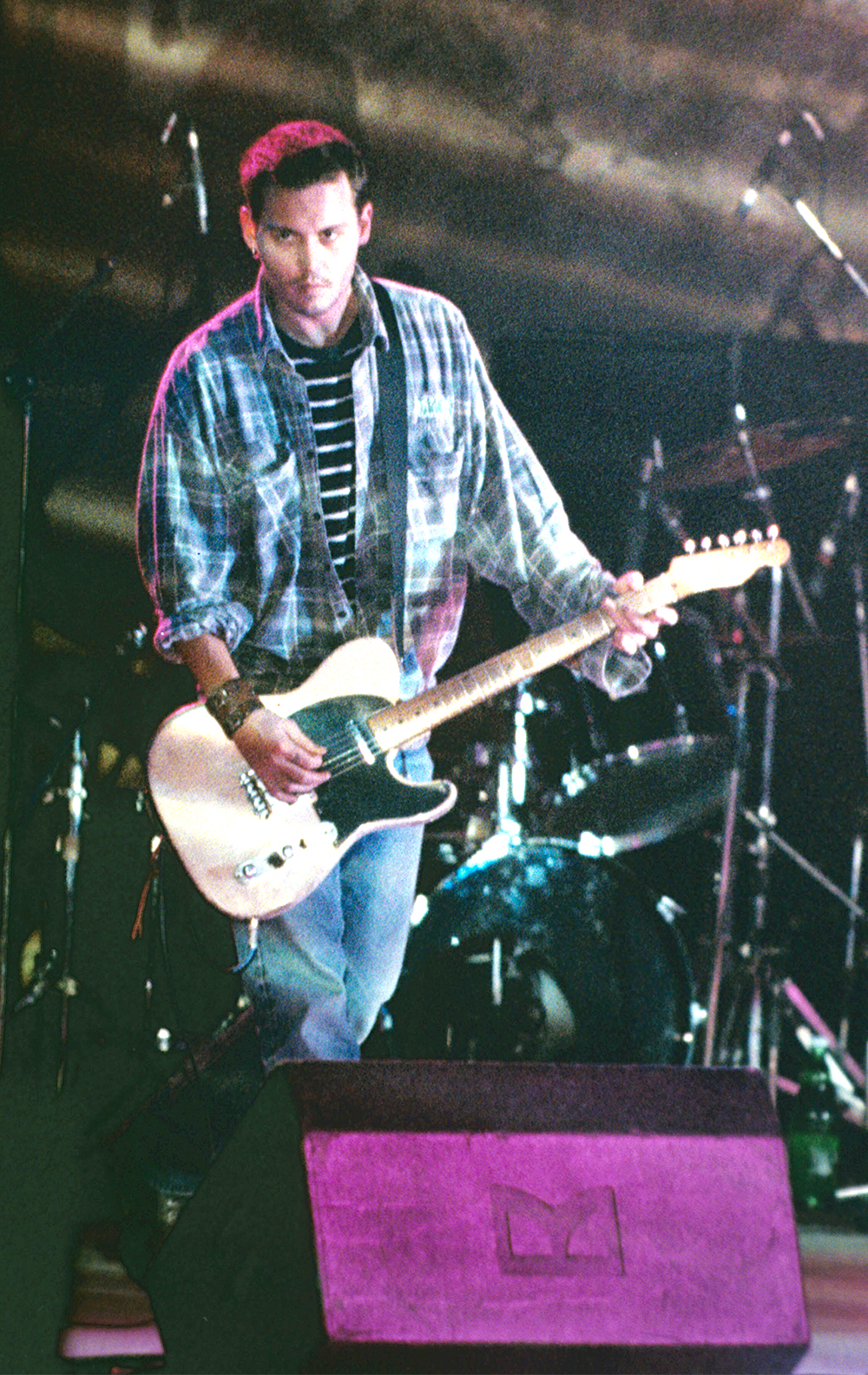 <p>Johnny Depp has never shied away from his love of performing music. In 2021, he is part of the Hollywood Vampires, a band featuring Alice Cooper and Joe Perry of Aerosmith. Here, a 34-year-old Johnny plays to a crowd in Vienna, Austria in 1997.</p>