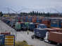 Trucks wait to enter the port at the Port of Los Angeles in Los Angeles, California, US, on Tuesday, June 6, 2023. West Coast dockworkers and their employers have been holding labor contract negotiations for over a year, with the occasional slowdown or work stoppage interrupting the flow of cargo that goes through the USs biggest import hub.