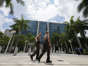 Miami Dade Sheriff deputies walk in front of the Wilkie D. Ferguson Jr. federal courthouse building in Miami.