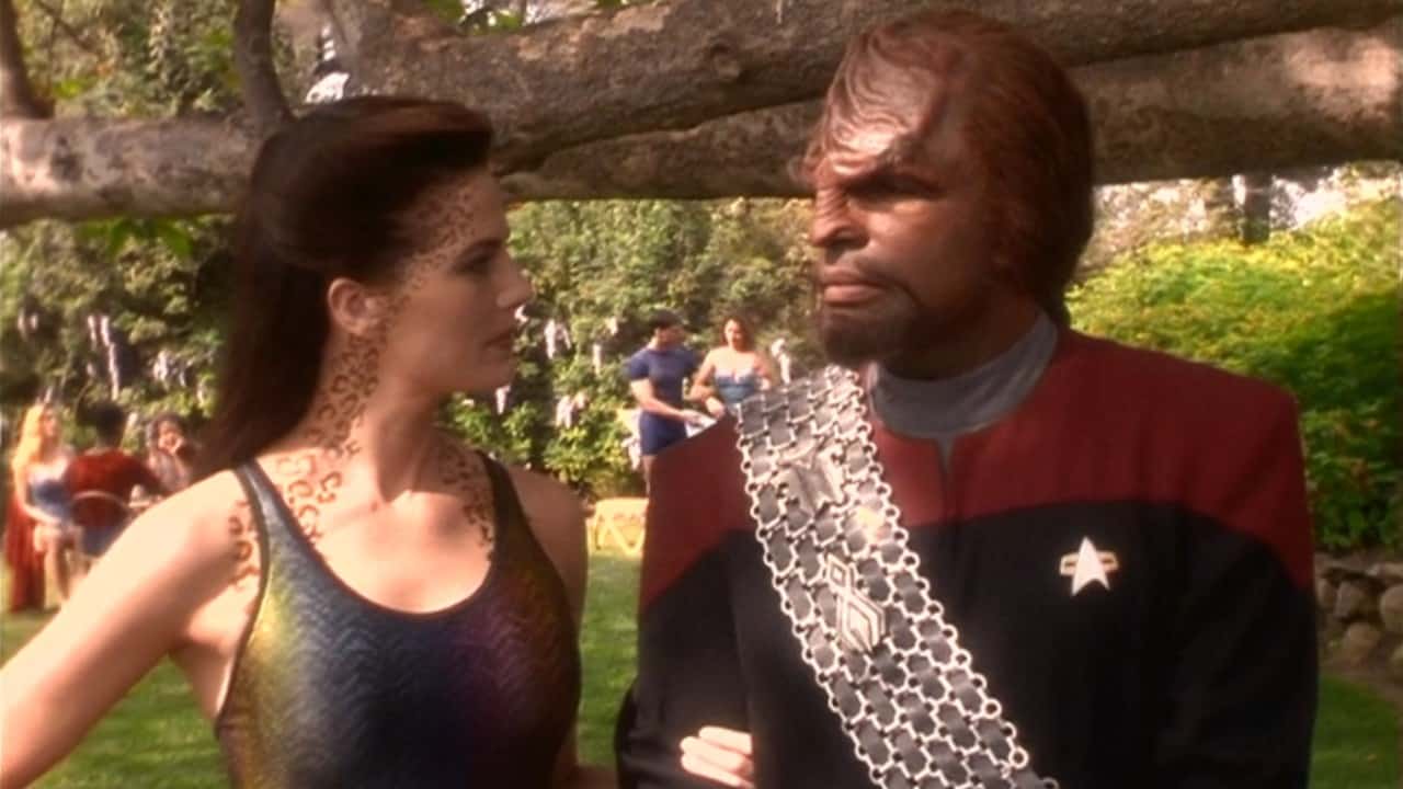 <p>Early in their relationship, Jadzia (Terry Farrell) and Worf (Michael Dorn) take a trip to the pleasure planet Risa. Disgusted by what he sees on the planet, Worf joins forces with a conservative group who believes the people of the Federation have grown too soft. The Klingon helps them sabotage the technology controlling the weather on Risa, changing the idyllic paradise into an inhospitable mess.</p>