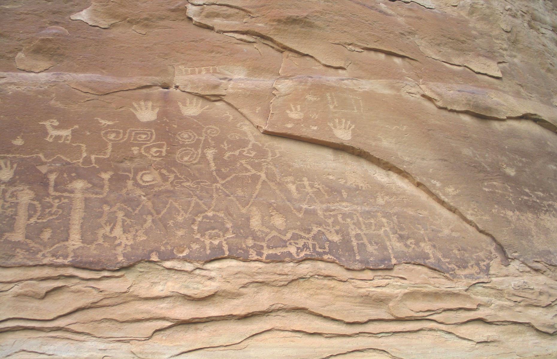 <p>Petroglyphs are carvings in rocks that feature motifs including figures in procession, handprints, animal tracks, wavy lines, spirals, concentric circles, animals and hunting scenes. According to Puebloan experts, they're said to reflect perceptions of place, environmental situations and hope for what may come. The main rock art panel in the park is called Petroglyph Point (pictured).</p>