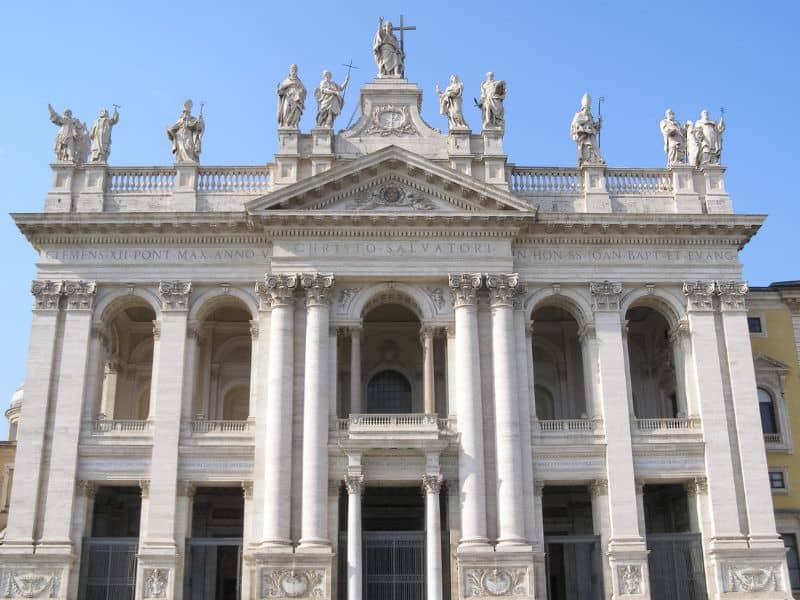The impressive basilica of Archbasilica of St. John Lateran with its stunning architecture, adorned with intricate details and towering columns. Step inside to discover awe-inspiring artworks, majestic chapels, and a sense of spiritual serenity.