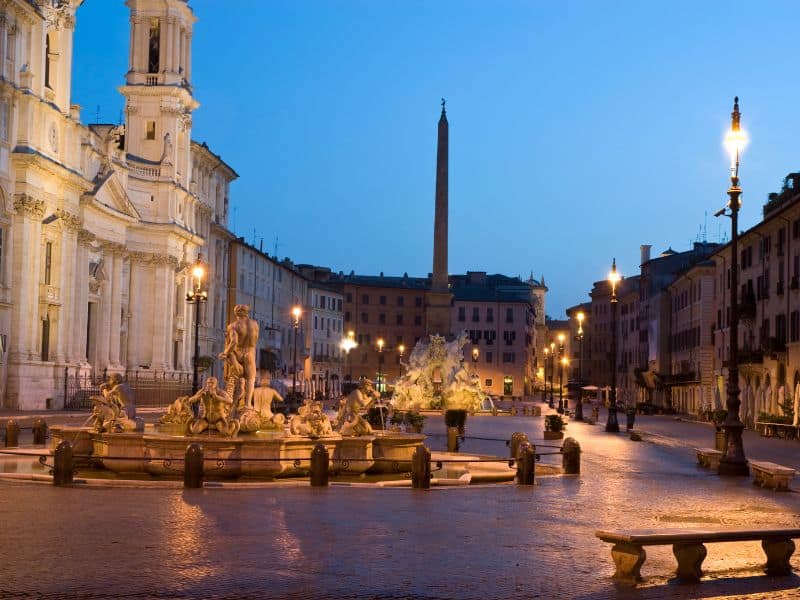 The peaceful and vibrant Piazza Navona at night.