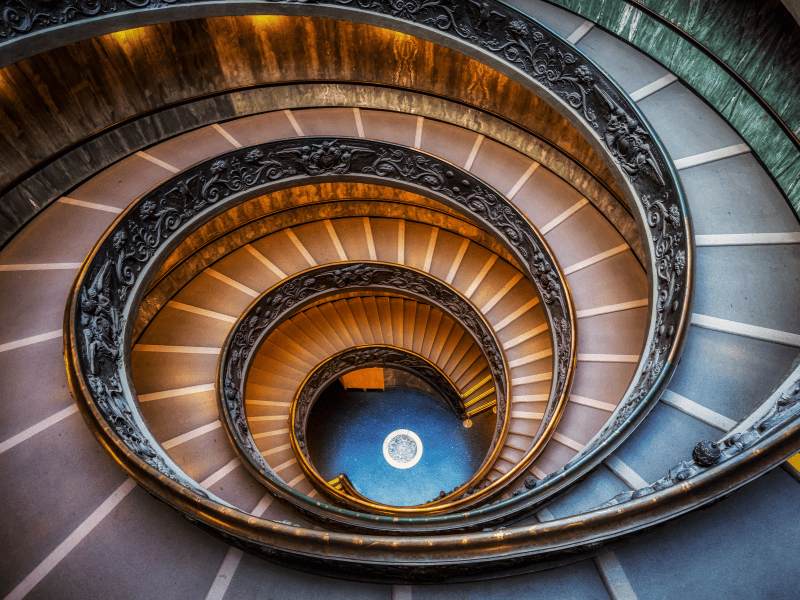 Mesmerized by the captivating spiral staircase in the Vatican Museums, a beautifully crafted architectural marvel that spirals upwards, beckoning you to explore the wonders that lie ahead.