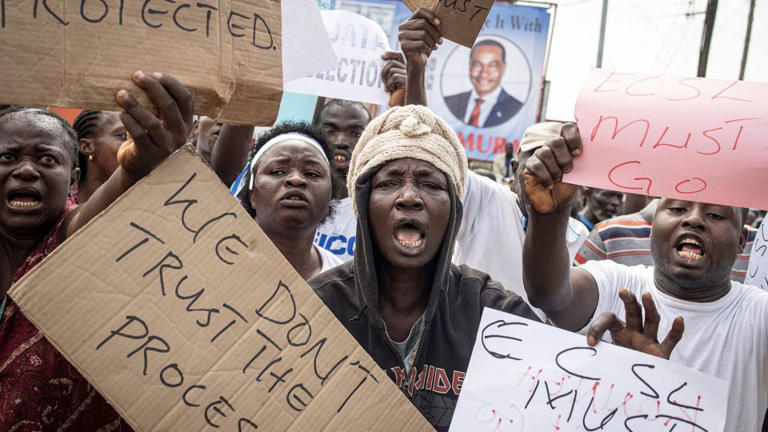 Sierra Leone’s president takes early lead in tense election race