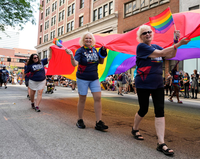 A large rainbow flag is hoisted into the air on Saturday, June 24, 2023, during the Cincinnati Pride Parade in Cincinnati. The parade celebrates its 50th anniversary this year.