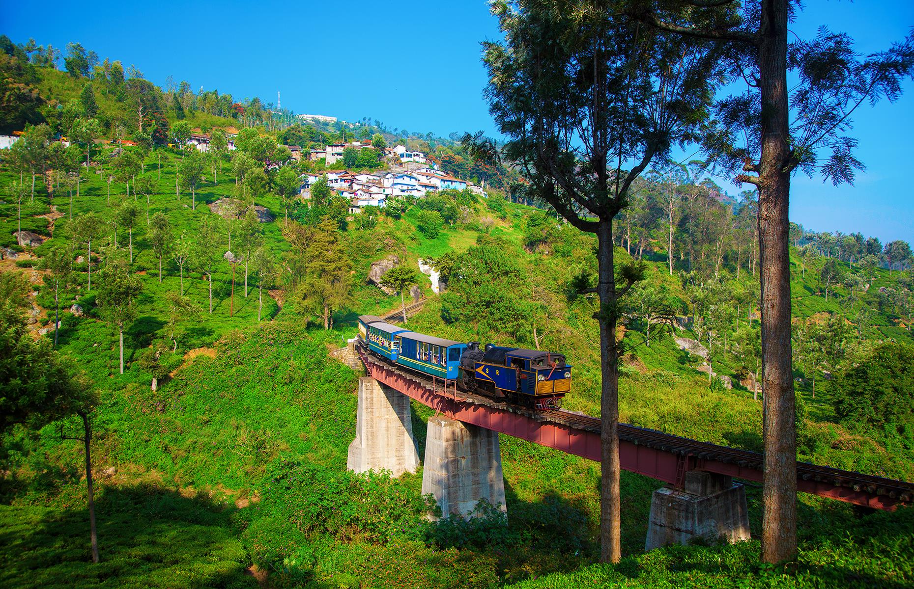 <p>India's only rack railway, the Nilgiri Mountain Railway from Mettupalayam to Udagamandalam is part of the UNESCO-listed Mountain Railways of India but a one-way ride in sleeper class won't cost you more than £2 ($2.40). The train climbs the mountain rather sharply – it has the steepest track in Asia with a maximum gradient of 8.33%. The route takes exactly 290 minutes to go uphill, yet the return journey is 75 minutes shorter.</p>