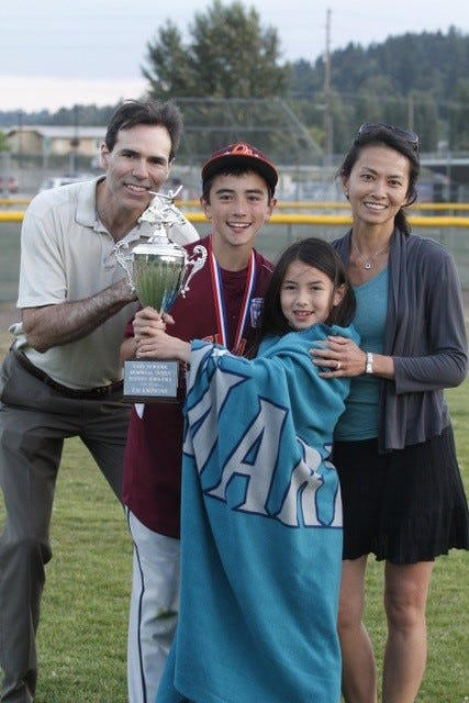 Corbin Carroll with his father Brant, left, mom Pey-Lin, right, and sister Campbell, middle.