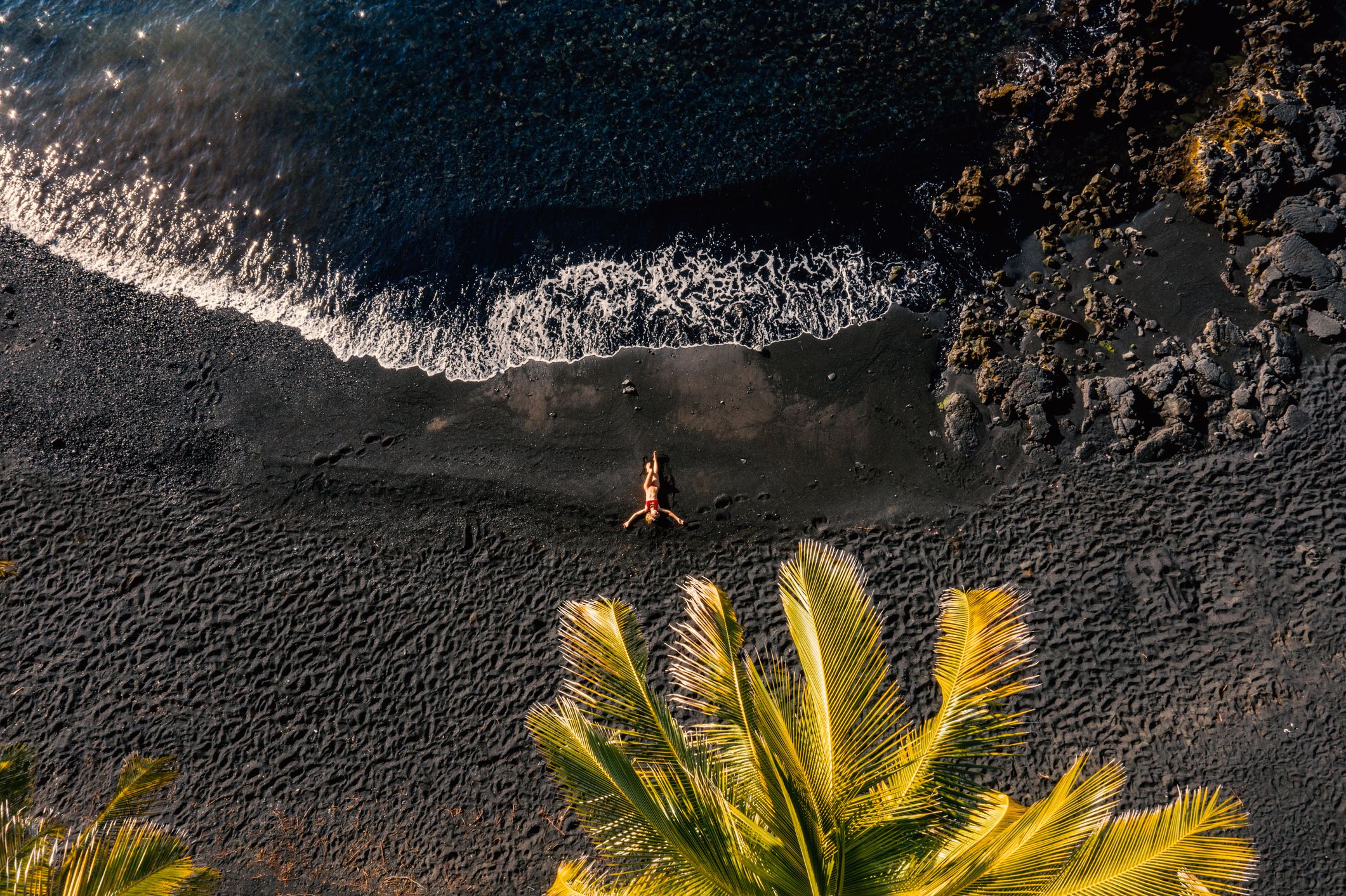 <p>Of course you need beach time, so why not head to the black sand beach of Waiʻānapanapa State Park? It’s a great selfie spot. The black color comes from eroded rock mixed with sand.</p><p>You can also picnic, swim, and snorkel there. If you’re <a href="https://www.sofi.com/learn/content/tips-save-money-traveling-with-pets/">traveling with a pet</a>, know that the park allows leashed dogs, so it can be a good place to explore together.</p><p>To combat the throngs of visitors, the park now requires reservations, and entry is $5 per person plus a $10 parking fee. </p>