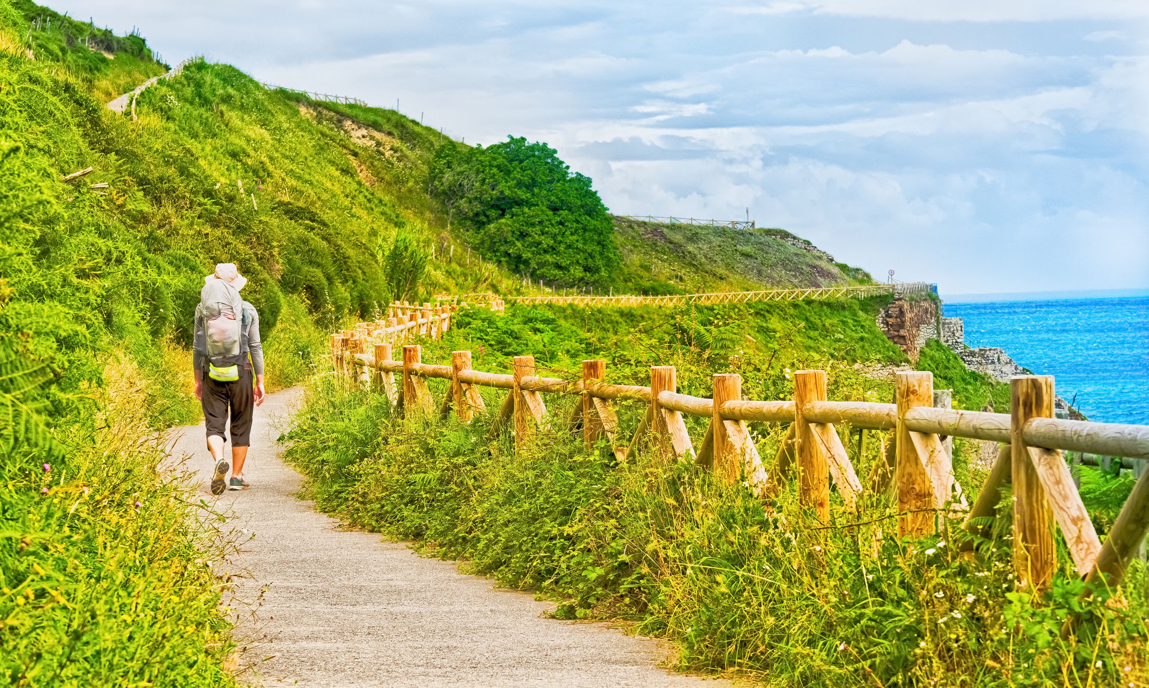 <p>The Camino de Santiago is an ancient tradition in which pilgrims would walk from their homes all the way to the Santiago Cathedral. There, the remains of St. James are kept, the person responsible for bringing Christianity to Spain.</p><p>Thousands of people still take the walk every year in honor of St. James, all of which start at different points throughout Spain. Camino Frances is the most popular route, beginning in the small town of St. Jean-Pied-De-Port.</p><p>You don’t have to walk the Camino in one long go since it takes around five weeks. At around 500 miles long, many pilgrims do the route in stages. But if you do plan on visiting, plan to start at the official point at St. Jean-Pied-De-Port with the rest of the pilgrims. It’s a wonderful experience to be part of.</p>