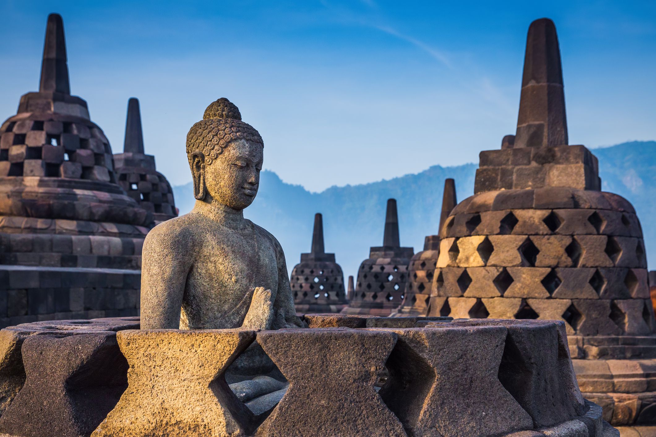 <p>Indonesia is expanding spiritual tourism to the Buddhist temple of Borobudur in the central Java Province. <a href="https://tidarheritage.org/">The Tidar Heritage Foundation</a> has put together a cultural program that they hope will make the site as relevant for spiritual pilgrimage as Jerusalem or Rome.</p><p>Borobudur is the largest Buddhist temple in the world, built in the 8th and 9th centuries. It has three tiers, including a pyramidal base, cone-shaped middle, and a stupa at the top.</p><p>The temple is adorned with 2,672 relief panels and 504 statues of Buddha. It’s a breathtaking temple to see in person, and you get a real sense of the scale.</p><p><em>“Borobudur Temple serves as a Buddhist place of worship, and the artwork features the stories and teachings of Buddha. As one of the seven wonders of the world, it’s visited by millions of people every year and holds deep cultural significance.”</em> – Mal Hellyer from <a href="https://rawmalroams.com/">Raw Mal Roams</a>.</p>