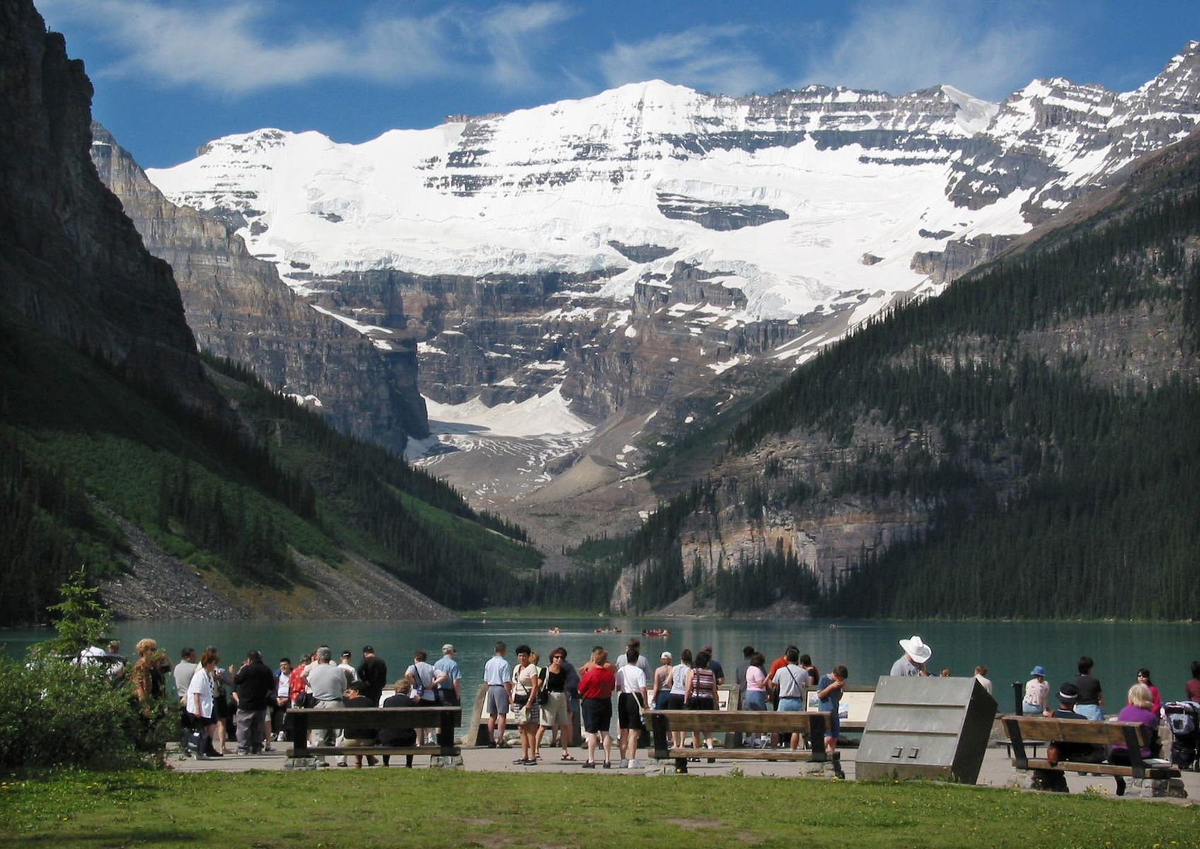 <p>One of the most iconic natural landscapes in the country, this scenic spot is a popular Canadian tourist attraction for good reason. Charming visitors with its turquoise waters, snowcapped peaks, and natural symmetry, <a href="https://www.banfflakelouise.com/experiences/lake-louise">Lake Louise</a> is a fan favourite. Teeming with tourists, especially in the summer months, Banff will cost you a pretty penny in food and accommodations. Seeing over 4 million tourists per year, the area is notorious for its <a href="https://skift.com/2023/01/19/canadas-crowded-banff-confronts-its-overtourism-problem/">overtourism problem</a> and car traffic. Even though the neighbouring <a href="https://www.banfflakelouise.com/experiences/moraine-lake">Moraine Lake</a> has also been plagued with increased foot and car traffic over the years, if you time it right it’s still possible to enjoy a quiet moment paddling by the sprawling pines and rocky landscape.</p>