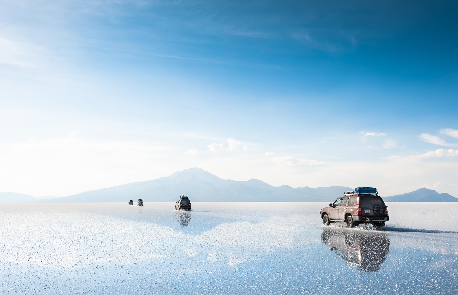 <p>Uyuni, in southwest Bolivia, is home to the world’s largest salt desert, sprawling across more than 4,000 square miles (10,359sq km). You can cross it in a 4x4 but getting out and standing on the vast white expanse will give you a real idea of its incredible size.</p>