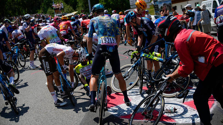 Riders get back up after crashing during the 15th stage of the Tour de France on Sunday, July 16, 2023. AP Photo/Daniel Cole