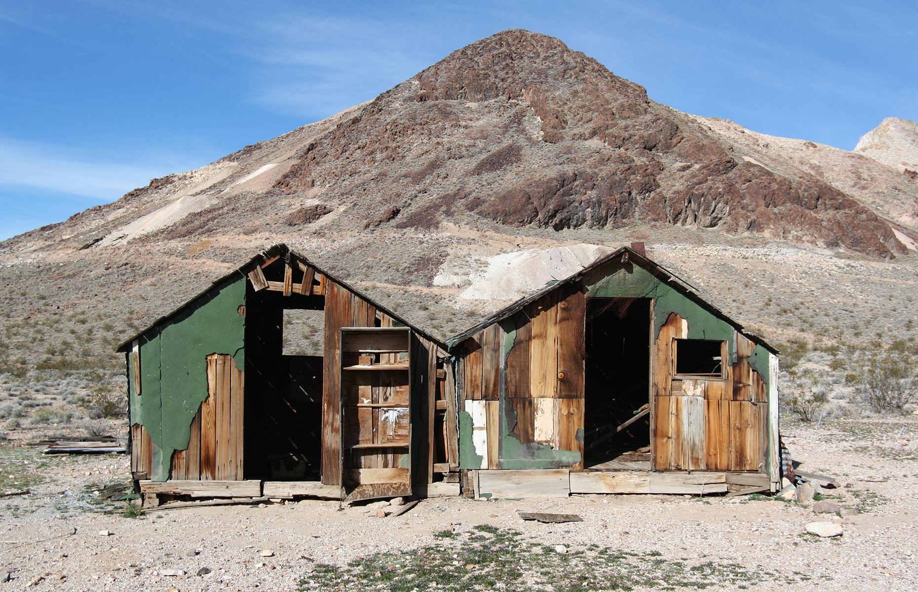 <p>The Silver State matches Montana when it comes to ghost towns, with 106 scattered across Nevada's vast, desert-stitched landscape. You'll find so-called 'living ghost towns' like Paradise Valley, where a small population still lives outside the deserted downtown core, and once-lawless mining settlements such as Techatticup. Photogenic Rhyolite (pictured) should be on the list too: it was once a mining town of more than 5,000, but now its deserted train station and bank building are the preserve of tourists and filmmakers (the town is a readymade movie set). </p>