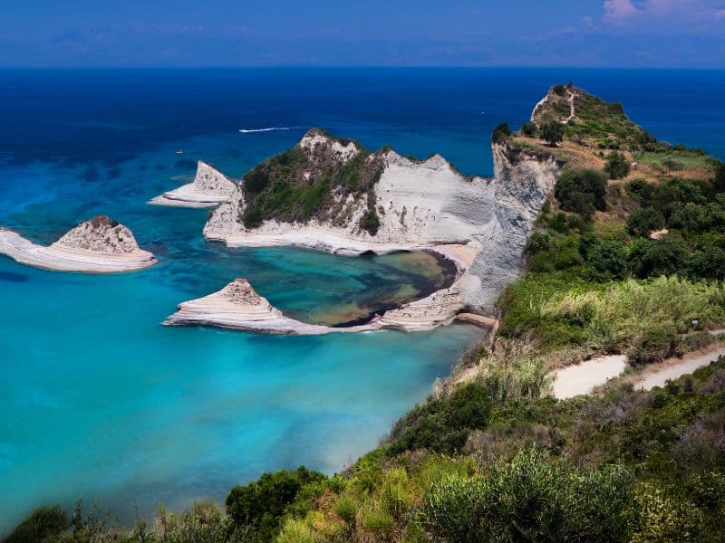 Corfu Island white cliffs against a tourquoise sea