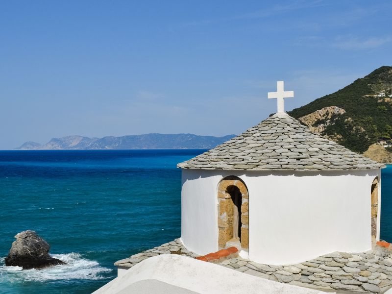 Skopelos, white church with ocean in background