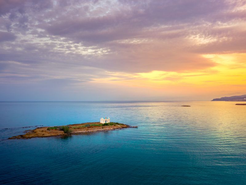 Sunset over the water in Malia, Crete