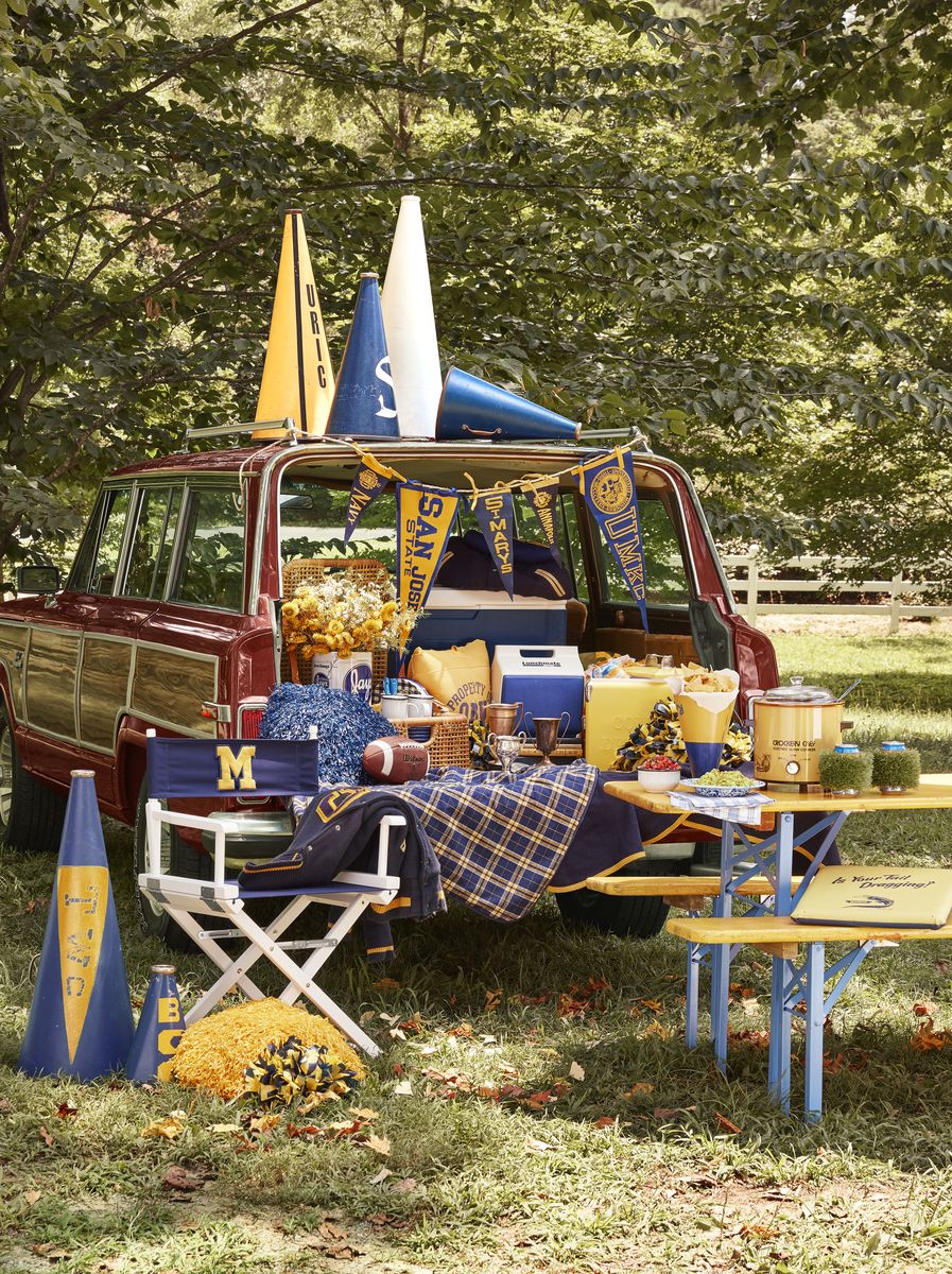 <p>For the sports-lover turning 50, celebrate with a tailgate-themed party. Gather megaphones, vintage pennants, and pom-poms to bring the look together, and of course serve up the <a href="https://www.countryliving.com/food-drinks/g1012/easy-tailgating-recipe-ideas-0910/">best tailgating foods</a>. If it happens to be game day, even better!</p>