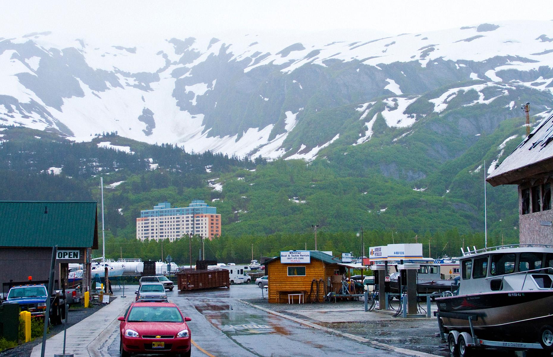 <p>However, while isolated, Whittier offers residents everything they need, not just contained in one town, but in one building. The 14-storey Begich Towers Incorporated, known locally simply as the BTI, may seem like a bit of a blot on the winter wonderland-eque landscape, but <a href="https://nypost.com/2023/06/08/in-this-alaska-town-everyone-lives-under-one-roof/">reportedly</a> almost all of the 200-odd Whittierites, it’s home…as well as the local hospital, school, police station, grocery store, church, post office, and city council headquarters!</p>