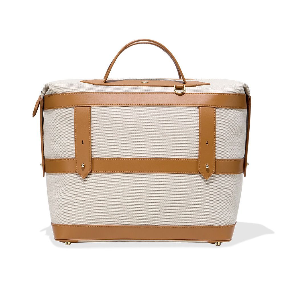 <p><strong>$295.00</strong></p><p>Get out of town in style with this leather-trimmed weekender. It’s sized to hold all of your essentials for a short trip, customizable with hand-painting or embroidery, and spill-proof, so you can worry a little less during transit.</p><p><strong>Dimensions: </strong>Length: 15 inches x height: 15 inches x depth 8 inches</p><p><strong>Color: </strong>Scout Tan and Domino Black</p><p><strong>Material: </strong>EcoCraft Canvas®, recycled vegan leather</p>