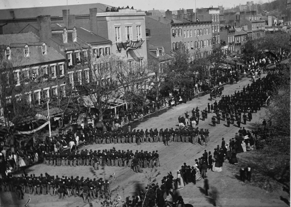 <p>On April 14, 1865, President Abraham Lincoln was assassinated at Ford's Theatre by stage actor and Confederate sympathizer John Wilkes Booth. <a href="https://americanhistory.si.edu/lincoln/funeral-procession">Abraham Lincoln's 1,700-mile funeral procession</a>, which was the first to involve travel by train, traveled through more than 400 communities in six different states, in addition to the country's capital, between April 19 and May 3. Here, the funeral procession is shown as it moves along Pennsylvania Avenue in Washington D.C.</p>