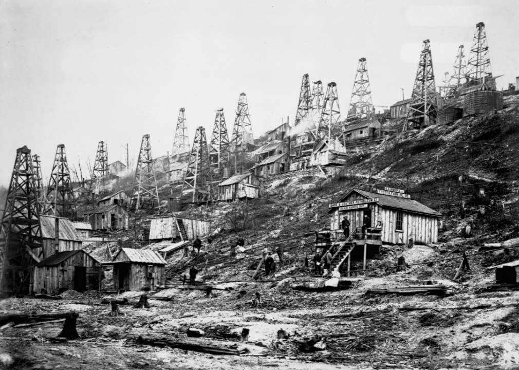 <p>While some people headed west to pursue precious minerals during the gold rush, others headed to Pennsylvania in the late 1850s to look for oil, or "black gold." The <a href="https://searchinginhistory.blogspot.com/2014/03/pennsylvania-oil-rush-of-1859.html">Pennsylvania Oil Rush started in 1859</a>, after oil—and, more importantly, its ability to replace steam and coal as a mode of power and fuel—was first discovered. Here, a cluster of hillside oil derricks owned by the Shoe and Leather Petroleum Company and the Foster Farm Oil Company is photographed in Pioneer Run, Pennsylvania.</p>