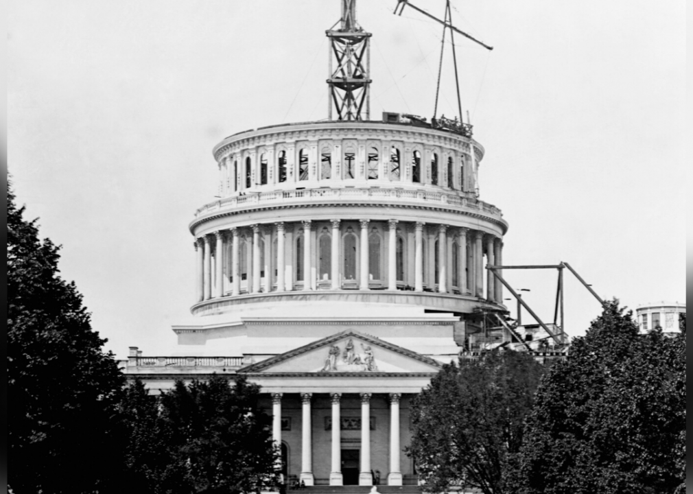 <p>The dome of the U.S. Capitol was designed by Philadelphia architect Thomas U. Walter, who took on the project after <a href="https://www.philadelphiabuildings.org/pab/app/ar_display.cfm/21624">entering a competition</a> to design an extension of the Capitol. While the <a href="https://www.aoc.gov/capitol-buildings/capitol-dome">government building had an original dome</a> added in the 1820s, additions to the Capitol over the subsequent years made the original dome feel too small. This photo shows the Capitol dome under construction, as the original wood-covered copper structure was replaced by Walter's new and improved cast iron design.</p>
