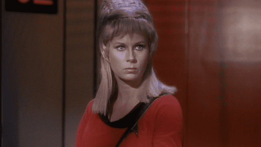 <p><span>Grace Lee Whitney was one of the original cast members of </span><i><span>The Original Series</span></i><span> and as Janice Rand, she was to be Captain Kirk’s (</span><a href="https://www.giantfreakinrobot.com/ent/william-shatner-star-trek-return.html"><span>William Shatner</span></a><span>) confidante. But it was determined that because of her looks that audiences might start to pair them up and Roddenberry didn’t want that for Kirk, so he got rid of the Rand character. </span></p> <p><span>Whitney actually returned to the franchise as Janice Rand in the feature films, </span><i><span>Star Trek: The Motion Picture,</span></i><a href="https://www.imdb.com/title/tt0088170/?ref_=nv_sr_srsg_0_tt_8_nm_0_q_The%2520Search%2520for%2520Spock"> <i><span>The Search for Spock</span></i></a><i><span>, The Voyage Home, The Undiscovered Country</span></i><span>, and for one episode of </span><i><span>Star Trek: Voyager</span></i><span>.</span></p>