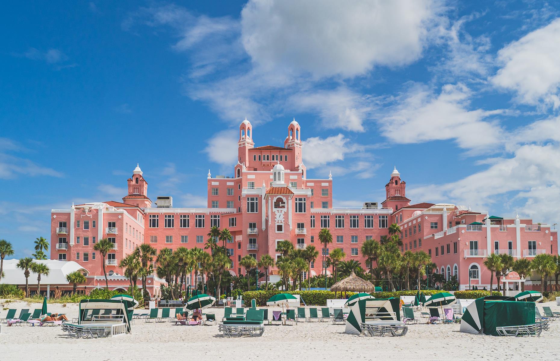 <p>Pink, palatial and with a prime position by the sugar-white sand of St Pete Beach, <a href="https://www.doncesar.com">the Don CeSar</a> opened in 1928. It also played host to man of the moment F. Scott Fitzgerald along with other socialites of the age. Built by architect Henry H Dupont, its flamboyant exterior exhibited Spanish and British colonial influences while extravagant Art Deco features adorned its lobby and ballroom. After being used by the army in World War II, it became office space through to the Sixties when it fell into disrepair. It reopened as a hotel in 1973 and is now listed on the National Register of Historic Places. </p>