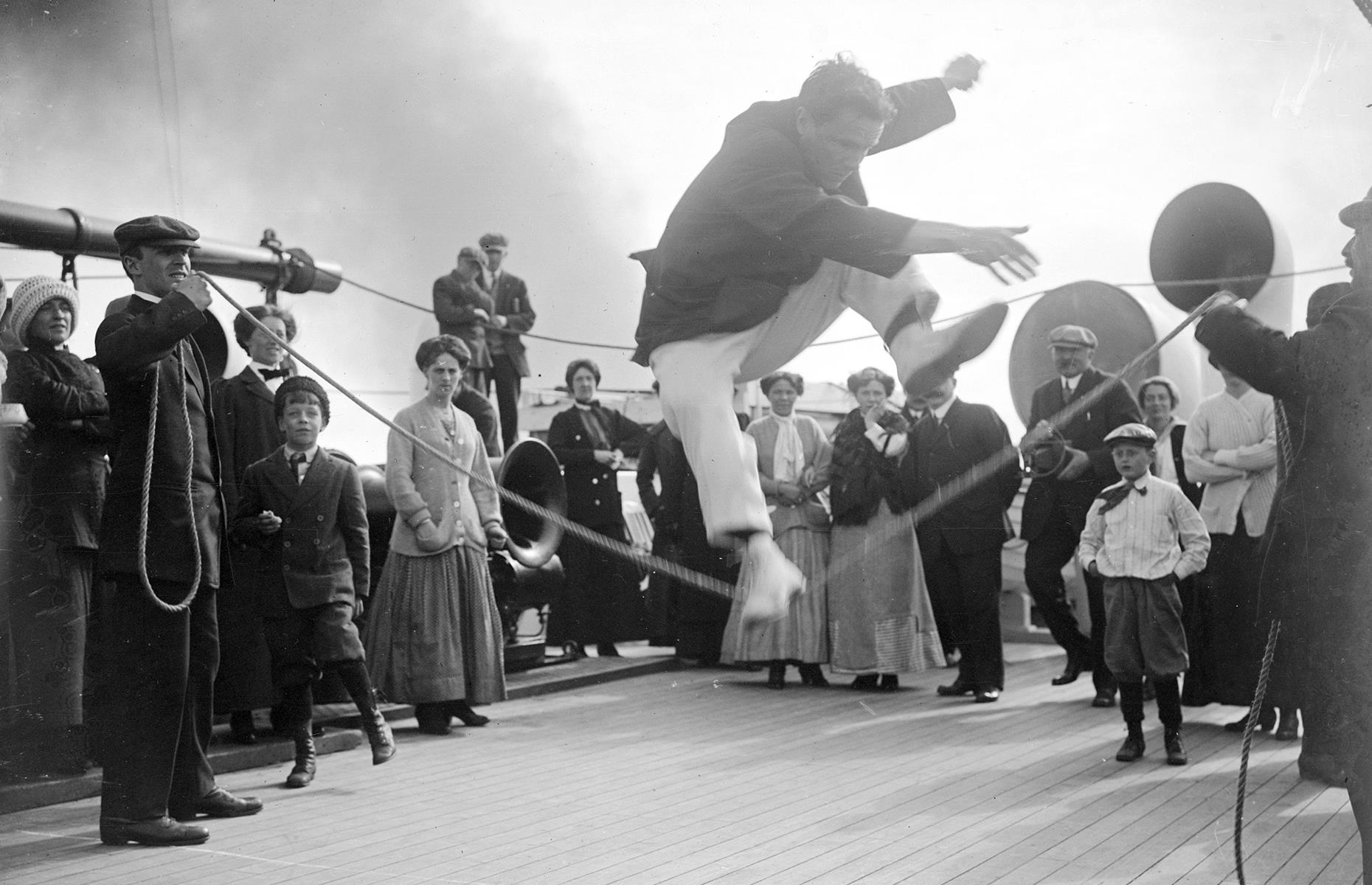 Many early 20th-century cruise ships had plenty of luxury amenities, but the entertainment on offer was a far cry from the glitzy shows and hi-tech attractions we're used to today. Common pastimes included shuffleboard, dancing and games like tug of war. Captured in 1912, these passengers on Cunard's Franconia enjoy a high-jump contest on deck.