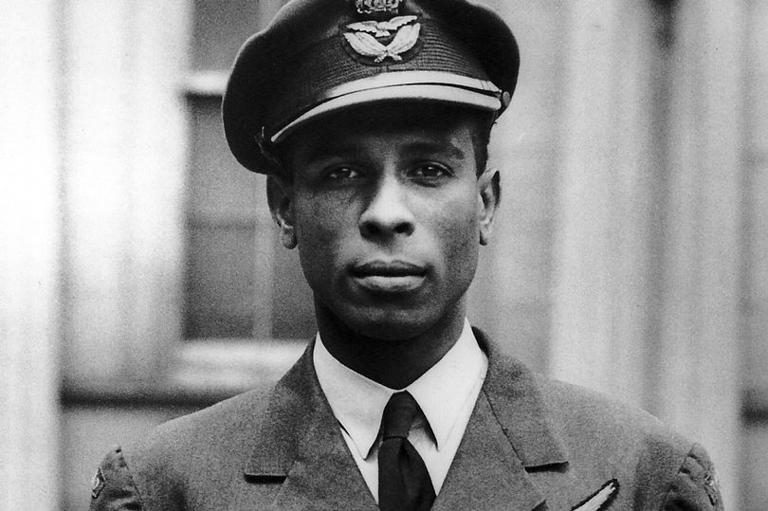 Squadron Leader Ulric Cross after receiving the DSO from King George VI at Buckingham Palace, July 1945