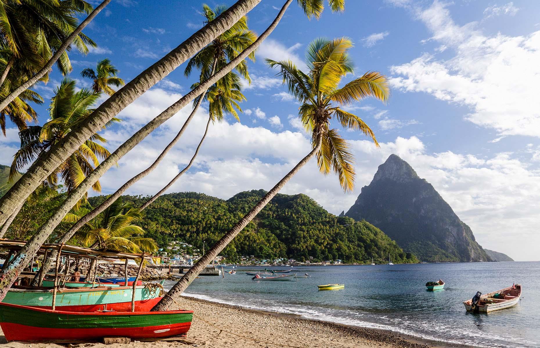 <p>Tucked away in the southwest corner of the island, <a href="http://www.loveexploring.com/news/90604/saint-st-lucia-holidays-caribbean-serenity-coconut-bay">St Lucia’s</a> UNESCO World Heritage-listed Pitons rise sharply from the Caribbean Sea, two triangular volcanic plugs clad in thick vegetation. Gros Piton is slightly taller at 2,530 feet (771m), with Petit Piton just behind at 2,438 feet (743m). Together they form a perfect backdrop for your St Lucian adventure – from the beach, a sailing boat or the pool at hotels such as Stonefield Resort. Alternatively, hike the well-marked trails on Gros Piton to experience their breathtaking beauty up close.</p>