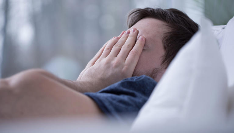 Man having some sleeping disorders like insomnia