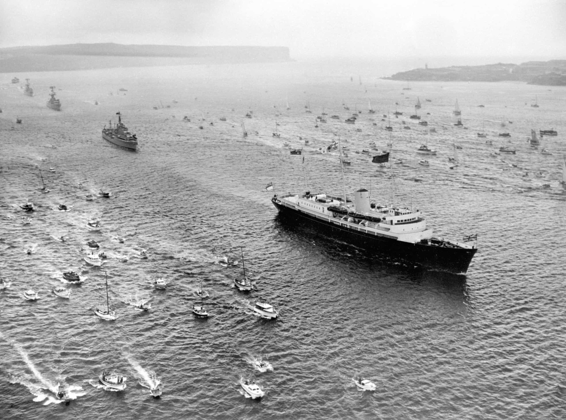 <p>Escorted by an armada of small craft, <em>Britannia</em>, bearing Queen Elizabeth II and the Duke of Edinburgh, arrives off Sydney Heads during their tour of Australia in 1963. Three escorting destroyers of the Royal Australian Navy follow in her wake.</p><p>You may also like:<a href="https://www.starsinsider.com/n/291814?utm_source=msn.com&utm_medium=display&utm_campaign=referral_description&utm_content=474709v1en-us"> Social situations that introverts dread</a></p>