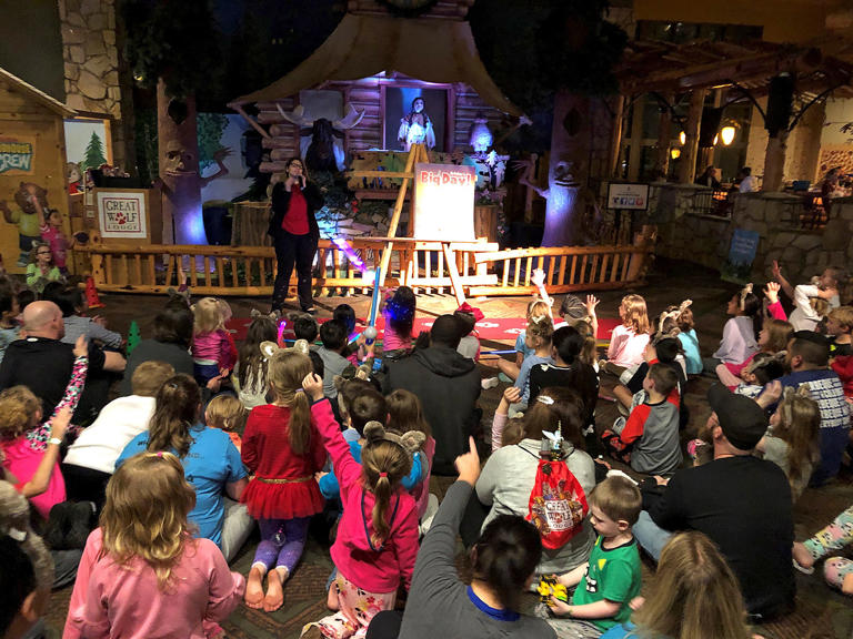 Families and guests at Great Wolf Lodge in Grapevine participate in an evening storytime in the Grand Lobby.