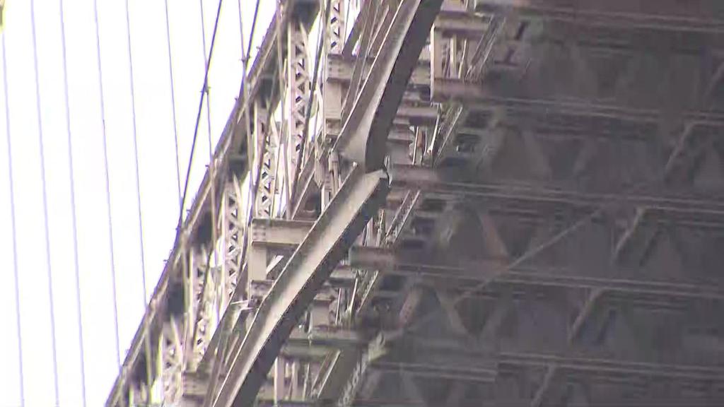 Barge carrying crane strikes side of Brooklyn Bridge
