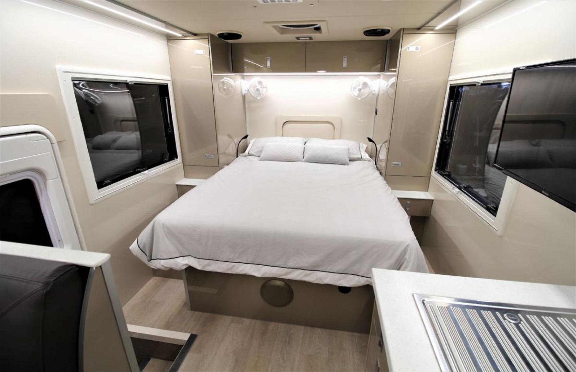 <p>Amazingly, the vehicle can sleep up to 10 people at a time, with space for six on the upper floor. Not one to sacrifice style for substance, the bespoke motorhome also includes a master suite on the main floor. There's even the optional addition of a lift-up electric bed, with a lounge space underneath – the perfect solution for guest accommodation. It's really no wonder the price of this vehicle <a href="https://www.businessinsider.com/custom-rv-expedition-camper-van-traveling-australia-slrv-2019-12?r=US&IR=T#-which-has-a-tv-and-six-single-beds-with-reading-lights-and-individual-windows-13">is said</a> to fall between $670,000 and $1.4 million, depending on your bespoke choices.</p>