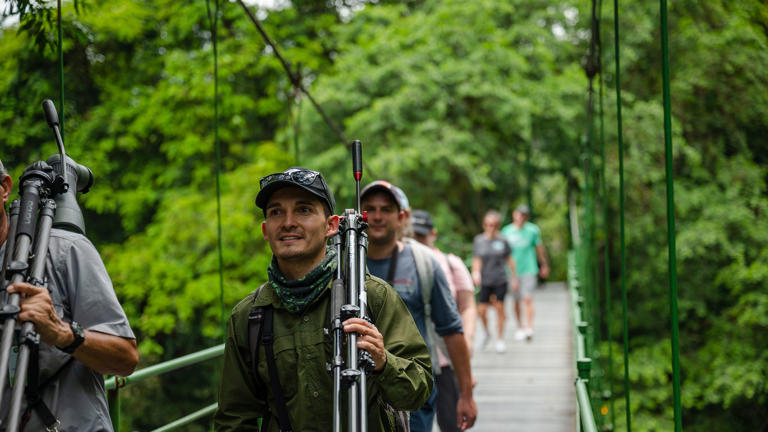Travelers on the National Geographic Expeditions' "Costa Rica: Wildlife and Conservation" trip hike through the La Selva Biological Station and Reserve.
