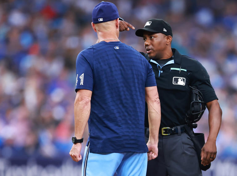 Blue Jays pitching coach Pete Walker bizarrely ejected as he covers up conversation
