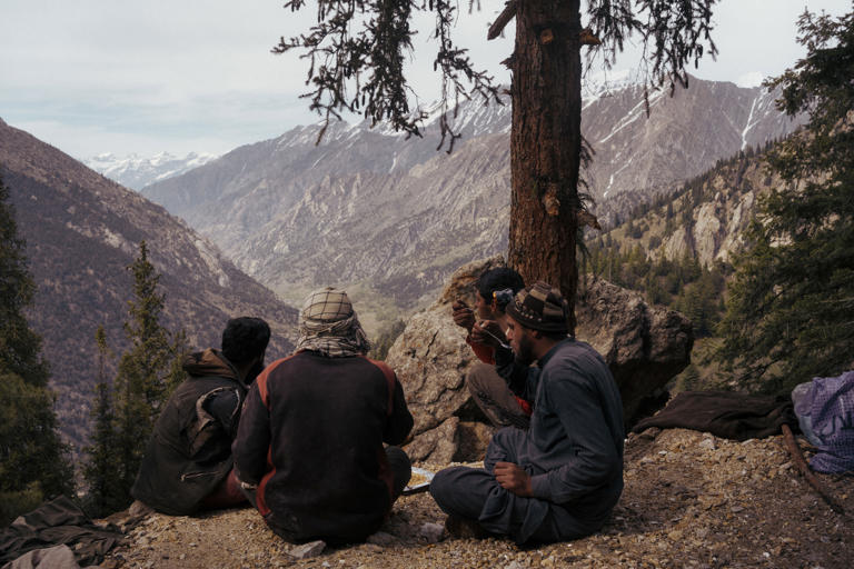 Workers on a lunch break outside a mine in the Parun Valley in Nurestan province.