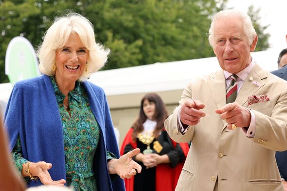 Queen Camilla wows in elaborate £599 silk peacock dress on visit to ...