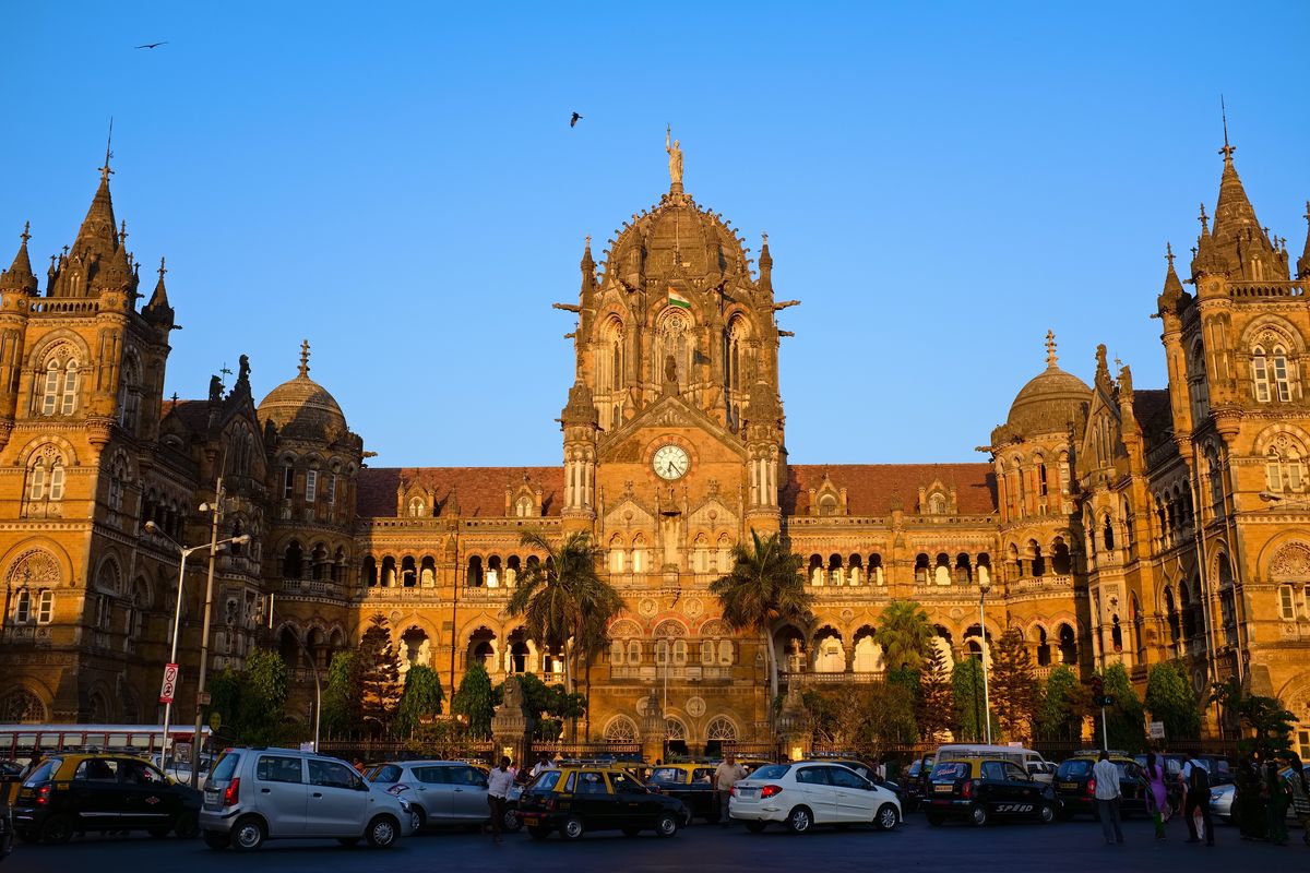<p><a href="https://cr.indianrailways.gov.in/">Chhatrapati Shivaji Terminus</a>, the gorgeous station formerly called Victoria Terminus, is a <a href="https://whc.unesco.org/en/list/945/">UNESCO World Heritage site</a> in the middle of Mumbai. The station was designed by British architect F. W. Stevens who worked with Indian artisans to bring the station to life. Some defining features include its tall turrets and pointed arches that embody the Victorian Gothic Revival style.</p>