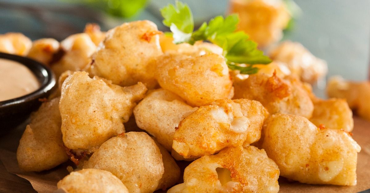 <p>  Cheese curds are made from curdled milk and are often squeaky when eaten. They already taste good by themselves, but if you fry them up and serve them with a favorite dipping sauce, you’ll be onto something. </p><p>Since nobody knows cheese better than Wisconsin, this is where you should dig into some cheese curds.    The Old Fashioned in Madison sells a lot. </p>