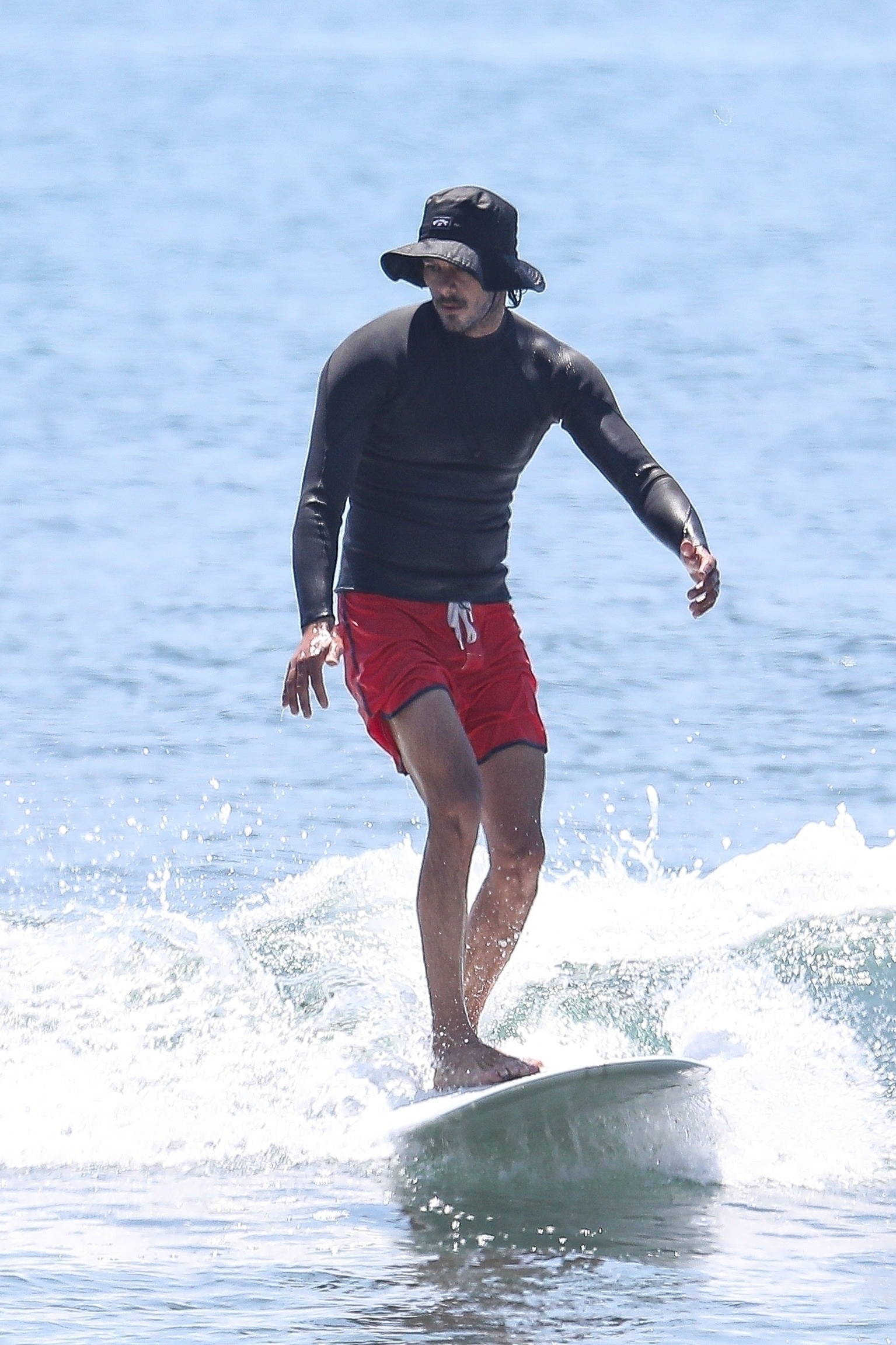 <p>Adam Brody caught a wave while surfing in Malibu on July 18.</p>
