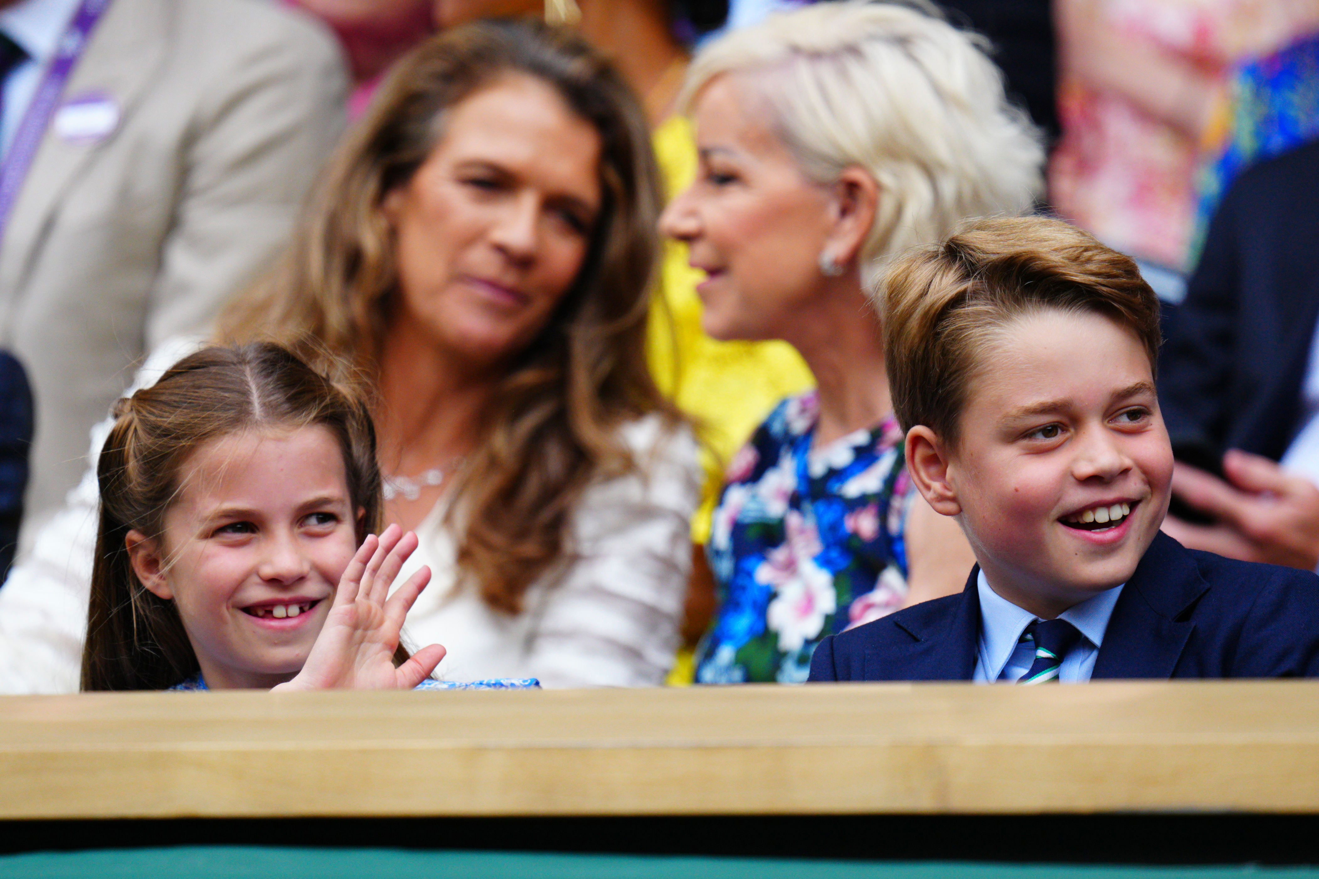 <p>Princess Charlotte and Prince George smiled and waved -- that's tennis legend Chris Evert behind them -- from the Royal Box on Centre Court during the Men's Singles final match on day 14 of the <a href="https://www.wonderwall.com/celebrity/wimbledon-2023-the-best-pictures-of-royals-and-stars-at-the-tennis-championships-758994.gallery">Wimbledon Tennis Championships</a> at the All England Lawn Tennis and Croquet Club in London on July 16, 2023.</p>