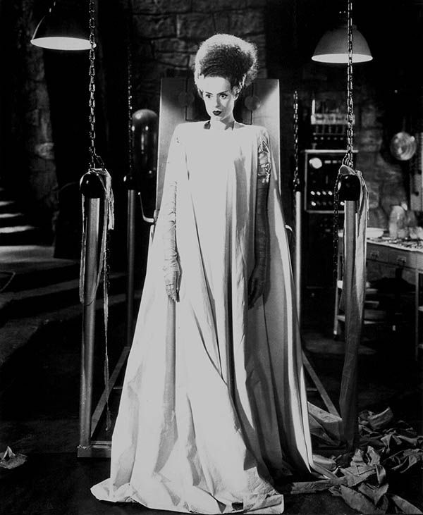 <p>Now that we know how vampires dress to get married, let’s look at lab-made monsters, shall we? According to <em>Bride of Frankenstein</em>, lady monsters wear flowing dresses like this one. Noted.</p>