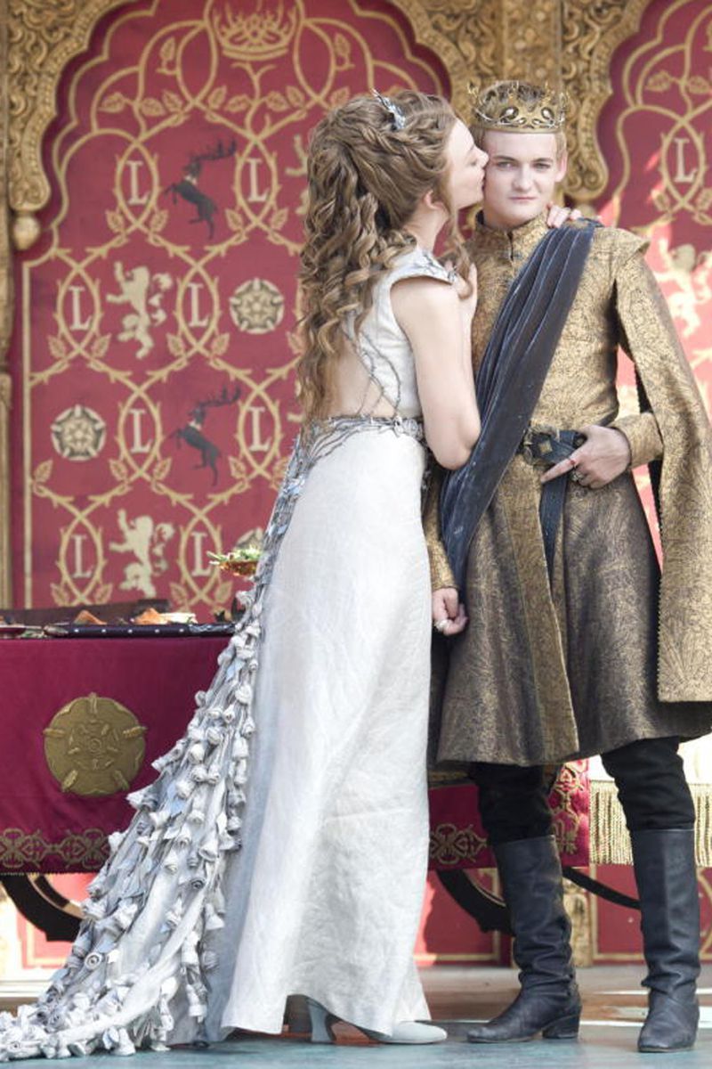 <p>While I have some major issues with the guy Margaery Tyrell is marrying here (yikes, girl, don’t do it!), I have no complaints about her pretty wedding dress, complete with a train of roses, which is a sweet tribute to her Highgarden upbringing. </p>
