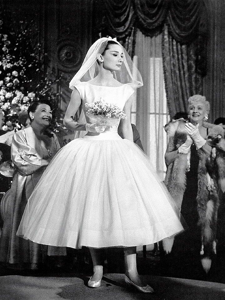 <p>Audrey Hepburn had many iconic movie looks, including this short satin-and-tulle Givenchy wedding dress. So chic. </p>